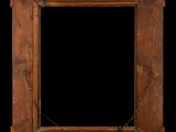 an old wooden frame with a chain hanging from it ' s sides