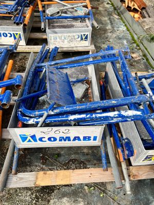 a lot of blue chairs that are sitting on the ground