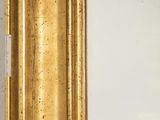 an image of a gold frame with a clock on the wall