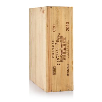 a wooden box with a bottle of wine inside of it