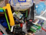 a plastic container filled with toys and other items