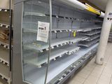 many empty shelves in the store for food to be bought