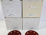 three discs of sand are sitting on top of a cardboard box