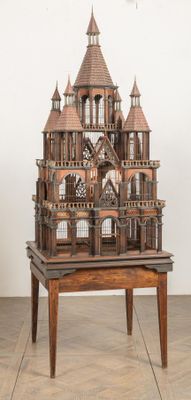 a wooden model of a castle sitting on a table