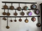 many pots and pans hanging on the wall