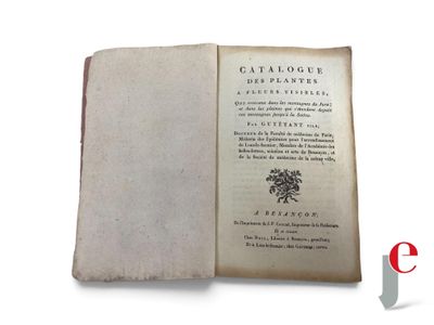 an open book with a picture of a flower on it