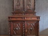 an old wooden cabinet with carvings and carvings on the doors
