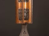 an image of a table lamp with a book on top of it