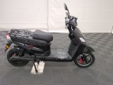 a scooter that is parked on a checkered floor
