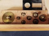 a wooden box with a bunch of knobs on it