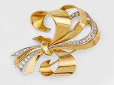 une image d'une broche en or et diamants