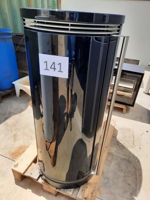 a metal trash can sitting on a pallet in a warehouse