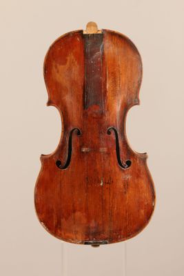 an old violin on a stand against a white background
