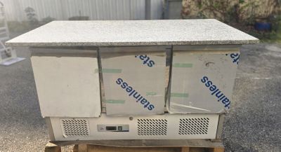two refrigerators stacked on top of each other on a pallet