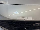 a close up of a car ' s front grill with a sticker on it