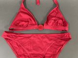 a pink bikini top and panties with a bow tie