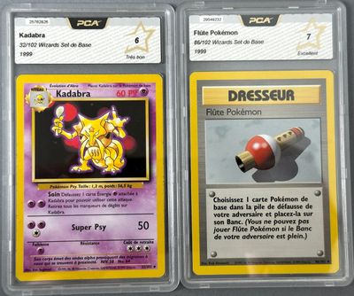 two pokemon cards with different designs on them on a table