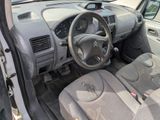 a car with a steering wheel and a dashboard
