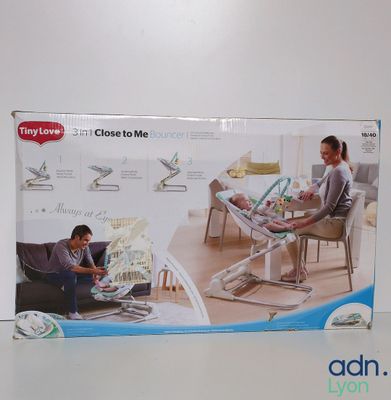 a box with a picture of a woman and a child sitting in a chair