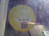 a sticker on the windshield of a car with a qr code on it