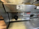 an image of a commercial pizza oven with the number 9 on it
