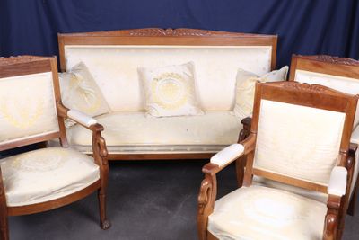 four chairs and a couch in a room