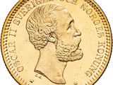 gros plan d'une pièce d'or sur laquelle figure le visage d'un homme