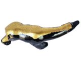 a figurine of a black and gold badger on a white background