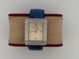 an image of a wrist watch with a blue band on a white surface