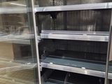 many empty shelves in a store that are empty