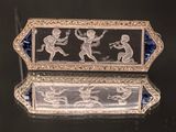 an image of a silver and glass box with a picture of a man and a woman