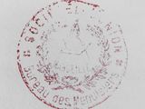 a red stamp on a white paper with a picture of a clock on it