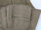 a pair of gloves that have writing on them