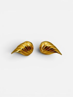 a pair of gold earrings on a white background