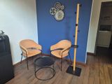two chairs and a table in the corner of a room