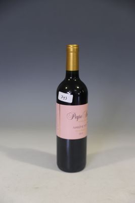 a bottle of wine that is sitting on a table