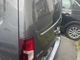a black van that is parked on the side of the street