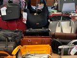a lot of purses on a table in a store