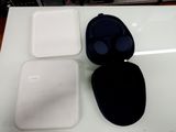 a white box with a black lid and a white box with a black lid