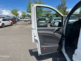 2020 ford transit van in a parking lot with the door open