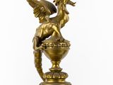 an image of a statue of a dragon on a marble pedestal