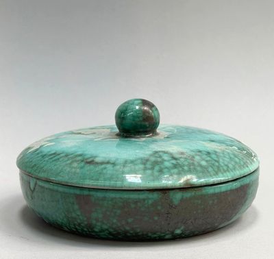 turquoise green ceramic covered dish with lid on a white surface