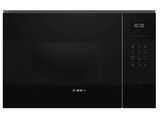 un four à micro-ondes noir posé sur un comptoir blanc