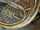 a close up view of a brass instrument in a room