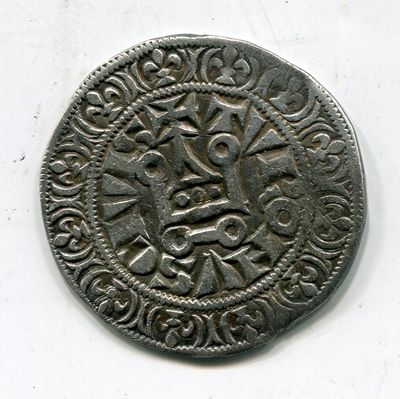 une pièce d'argent sur laquelle figure un motif