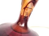 a glass vase with a picture of a woman on it
