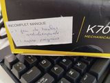 a box on top of a keyboard with a sticker on it