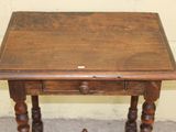 a small wooden table with a drawer underneath it