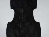 a sculpture of a cello sitting on top of a white pedestal