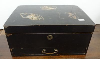 a small black box on a wooden table